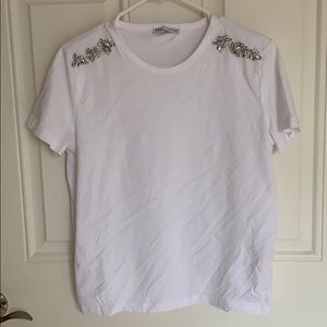 White tee w/ diamond appliqué on the shoulders